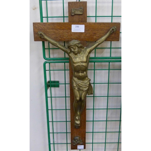 286 - A French oak and brass wall hanging crucifix