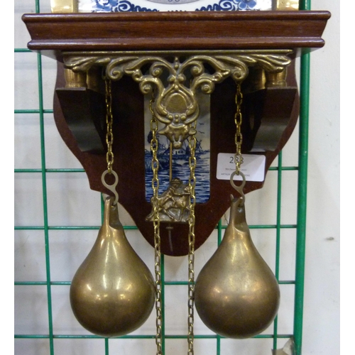 288 - A Dutch mahogany and brass wall clock