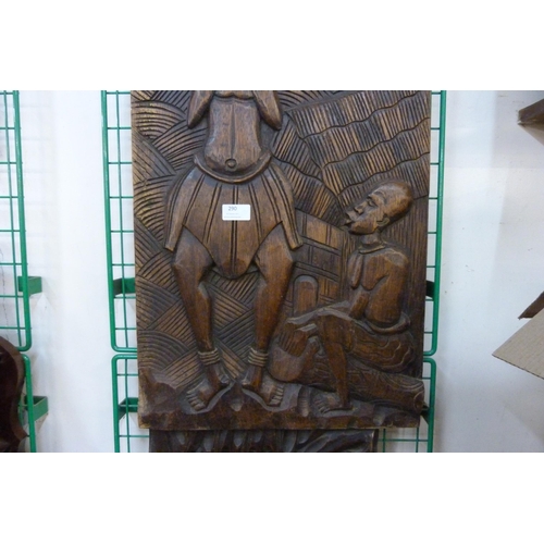 290 - Two African carved wooden plaques