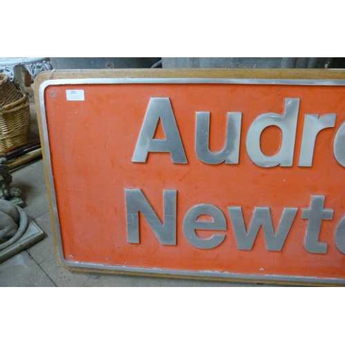 291 - A metal Audrey Newton sign