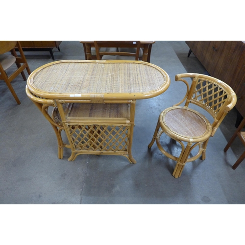 30 - A bamboo and wicker table and two chairs