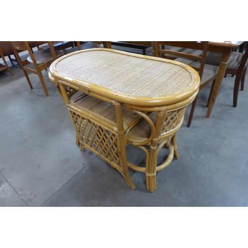 30 - A bamboo and wicker table and two chairs