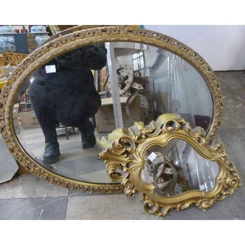 302 - Three gilt framed mirrors and one other