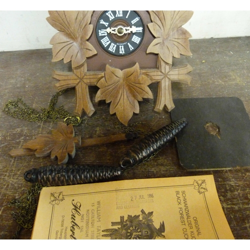 304 - A Black Forest beech and faux wood cuckoo clock