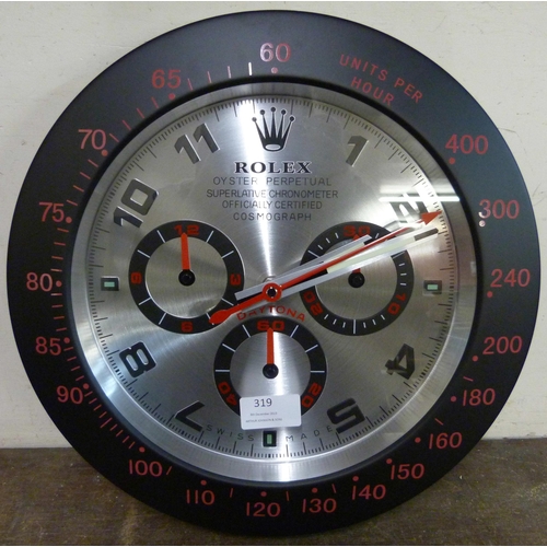 319 - A Rolex style dealer's display wall clock