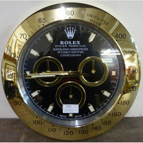 320 - A Rolex style dealer's display wall clock