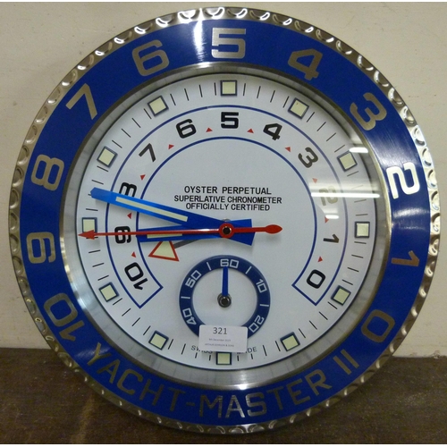 321 - A Rolex style dealer's display wall clock