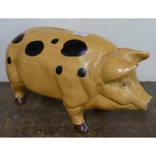 324 - A large painted metal pig shaped money box