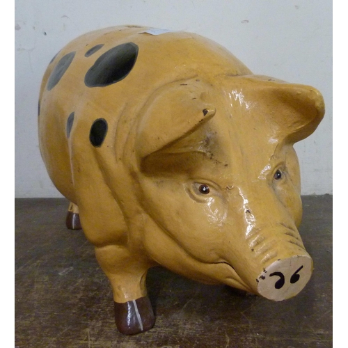 324 - A large painted metal pig shaped money box