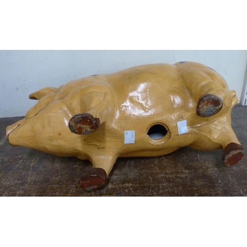 324 - A large painted metal pig shaped money box