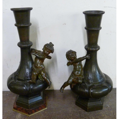 327 - A pair of French style bronze cherub vases