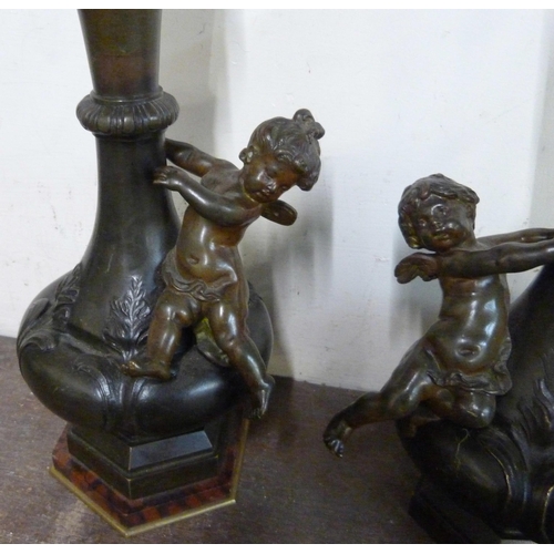 327 - A pair of French style bronze cherub vases