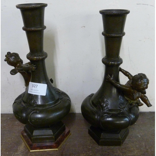 327 - A pair of French style bronze cherub vases