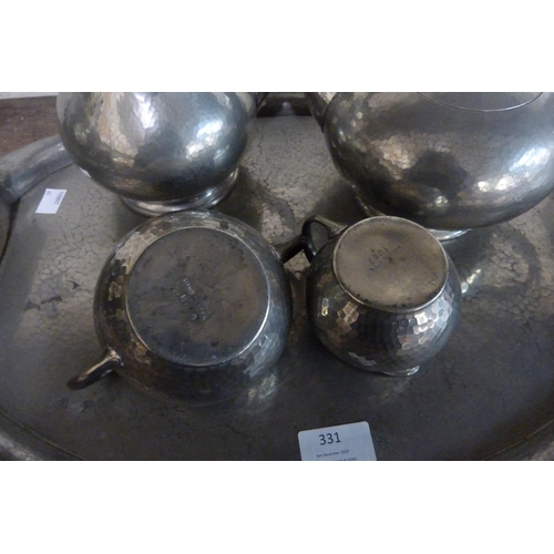 331 - An Arts and Crafts pewter coffee set with tray