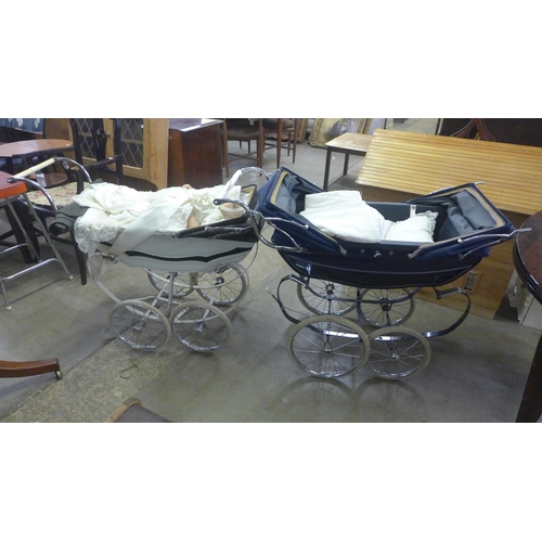 344 - Two vintage prams, one containing linen and a porcelain doll