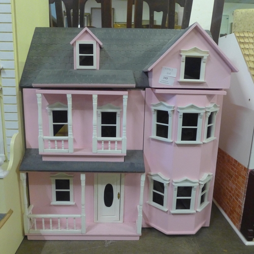 349 - A painted doll's house with accessories