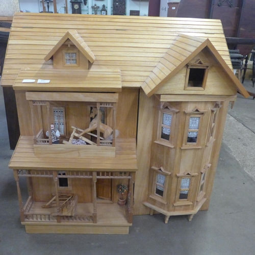 354 - A large wooden doll's house