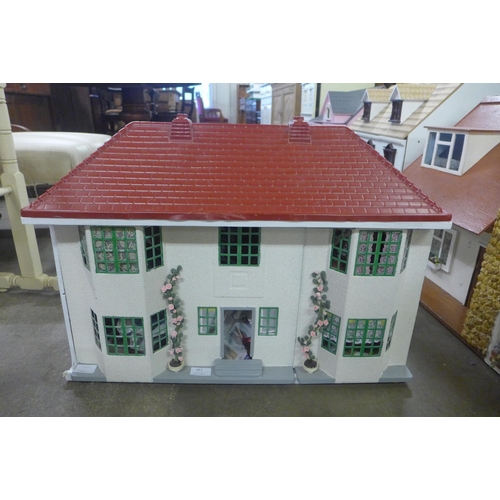 357 - A painted doll's house