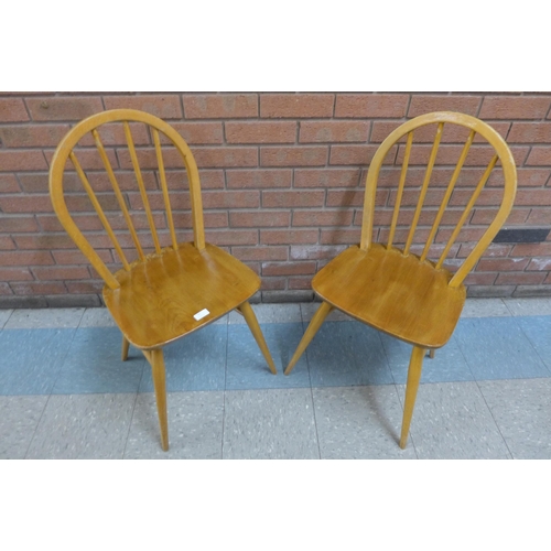50 - A pair of Ercol Blonde elm and beech Windsor chairs