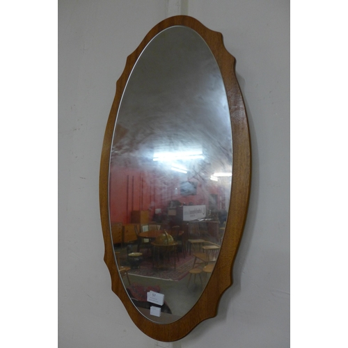 57 - A teak framed mirror