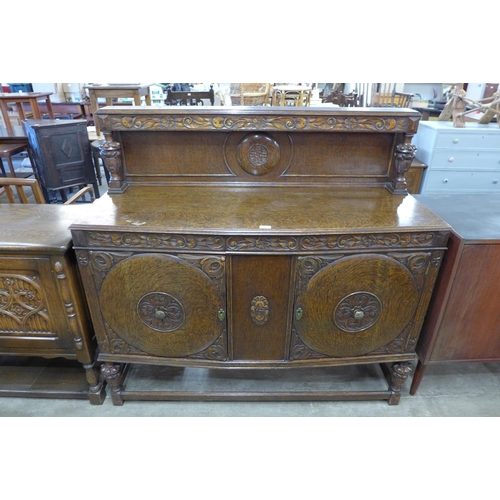78 - An early 20th Century carved oak six piece dining suite