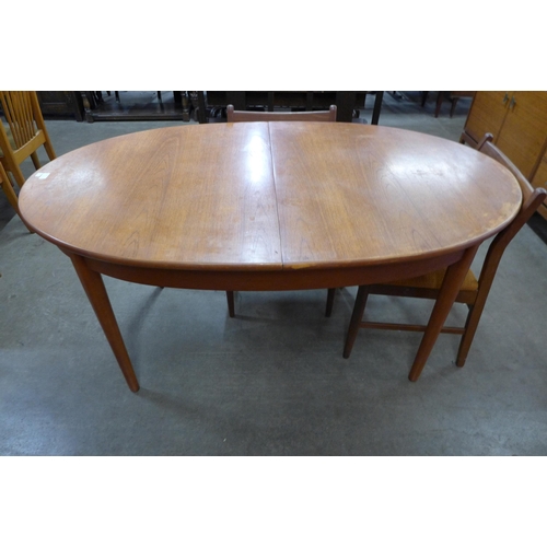 8 - A Jentique teak oval extending table and four chairs