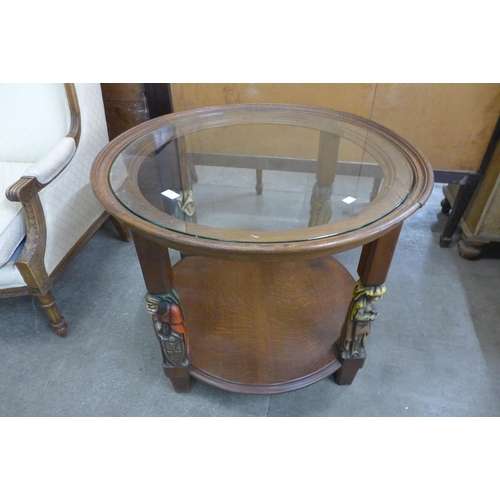 89 - A French oak and glass topped circular two tier coffee table