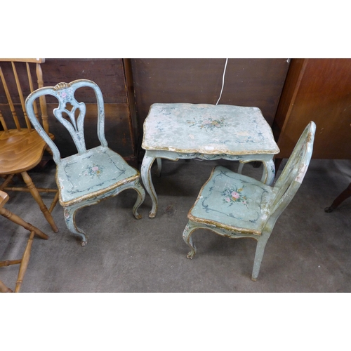 93 - An Italian style painted occasional table and two chairs