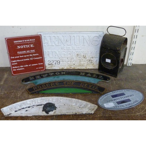 295 - A railway lamp and assorted railway plaques