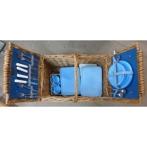 298 - A wicker picnic hamper, containing Brexton picnicware