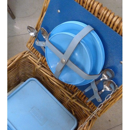 298 - A wicker picnic hamper, containing Brexton picnicware