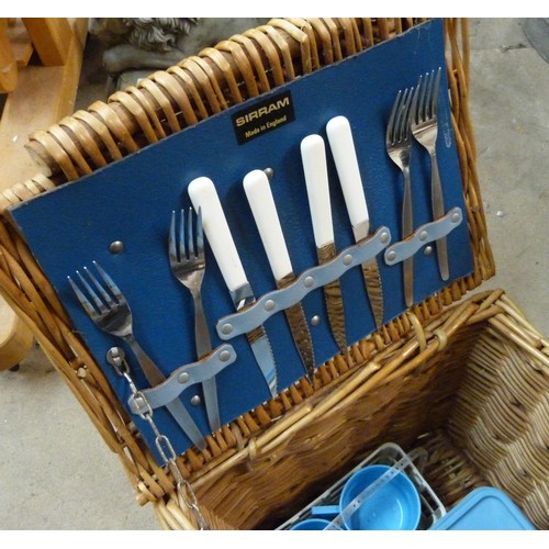 298 - A wicker picnic hamper, containing Brexton picnicware