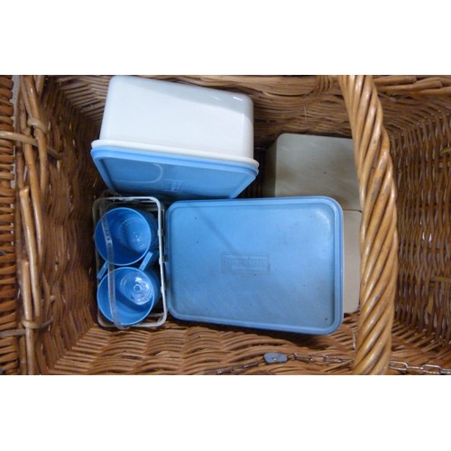 298 - A wicker picnic hamper, containing Brexton picnicware