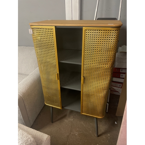 1591 - A gold rattan effect industrial style cabinet