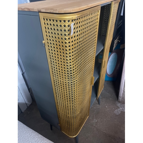 1591 - A gold rattan effect industrial style cabinet