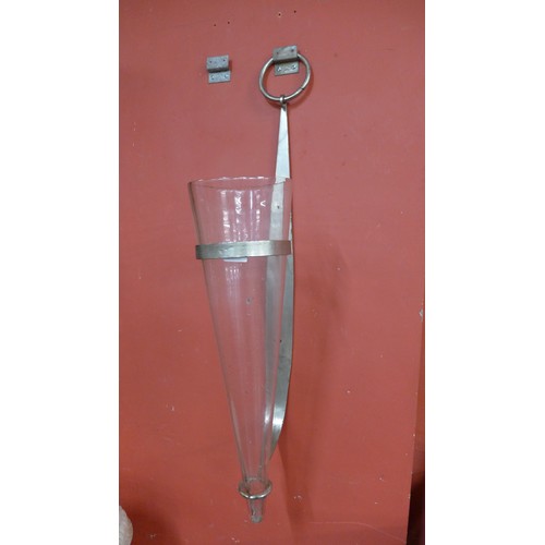 226 - A steel and glss wall hanging vase