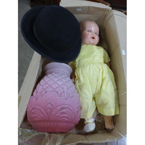 297A - A pink glass light shade, a bowler hat and a doll