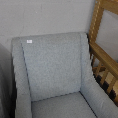 1601 - A blue upholstered small armchair * this lot is subject to VAT