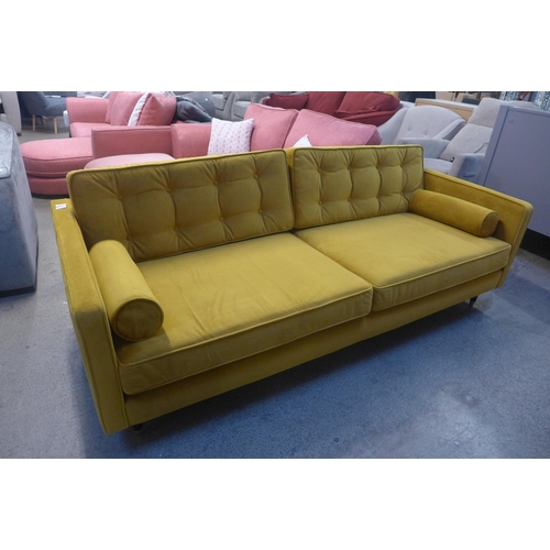 1496 - A mustard velvet upholstered mid-Century style three seater sofa