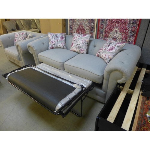 1498 - A grey textured weave upholstered three seater sofa bed