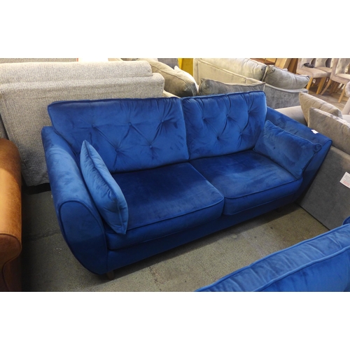 1502 - A Hoxton blue velvet upholstered three seater sofa