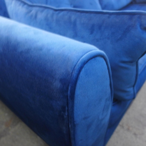 1502 - A Hoxton blue velvet upholstered three seater sofa