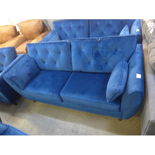 1503 - A Hoxton blue velvet upholstered three seater sofa