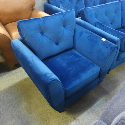 1504 - A Hoxton blue velvet upholstered armchair