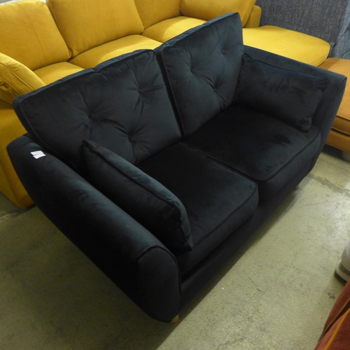 1517 - A Hoxton black velvet upholstered two seater sofa