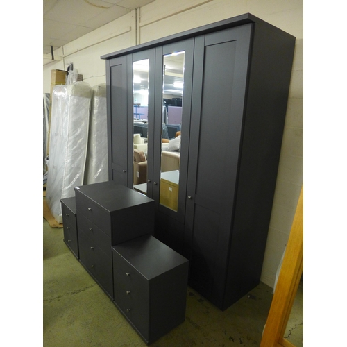 1551 - A large four door dark grey and mirrored wardrobe with a four drawer chest and a pair of bedside tab... 