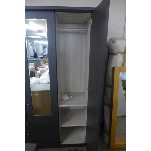 1551 - A large four door dark grey and mirrored wardrobe with a four drawer chest and a pair of bedside tab... 