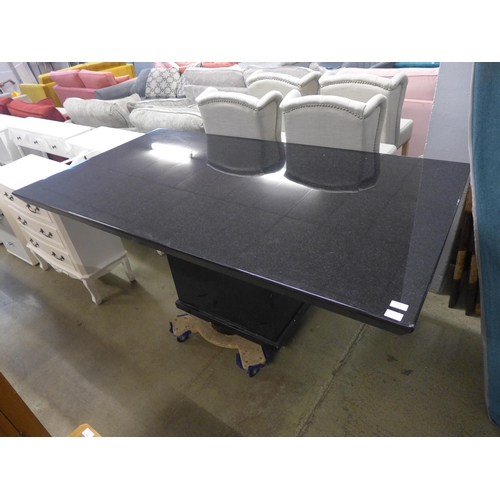 1563 - A black granite effect dining table