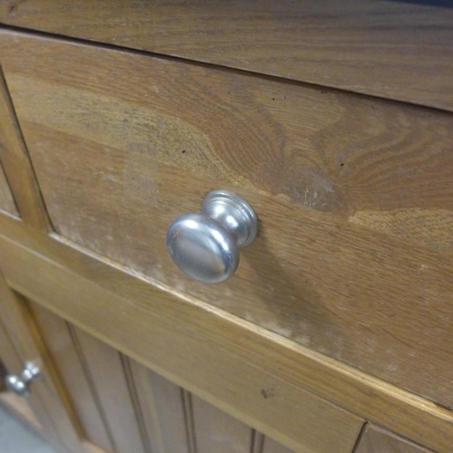 1593 - An oak and granite kitchen island unit