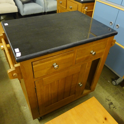 1593 - An oak and granite kitchen island unit